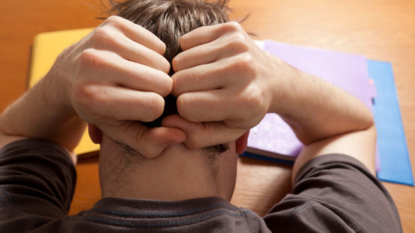 Man worrying and studying